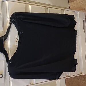 3/4 sleeve black top with lattice stitching at neck